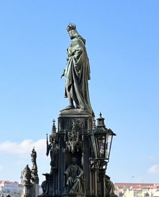 Bronze statue of kig Charles IV in front of the Charles Bridge of Prague