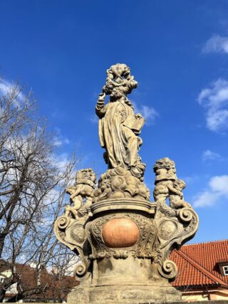Baroque stone statue of saint Kajetan on the Charles Bridge of Prague
