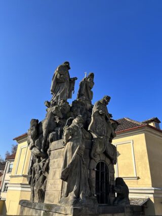Baroque stone statue of saint Felix on the Charles Bridge of Prague