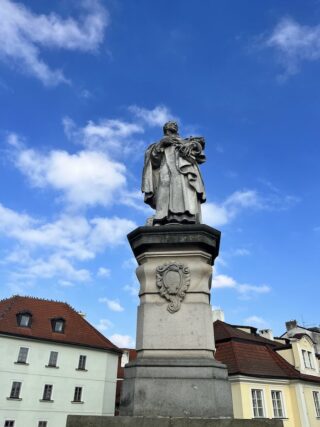 Baroque stone statue of saint Philip on the Charles Bridge of Prague