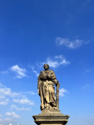 Baroque stone statue of saint Jude Thaddaeus on the Charles Bridge of Prague