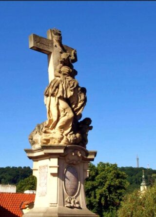 Baroque stone statue of saint Luitgarde on the Charles Bridge of Prague