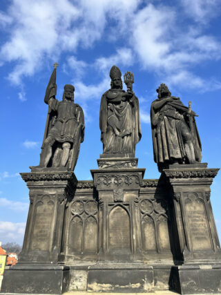 Baroque stone statue of saint Norbert on the Charles Bridge of Prague