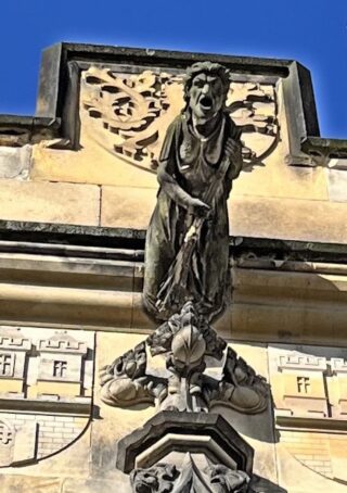 A witch statue on the Mala Strana gate of the Charles Bridge